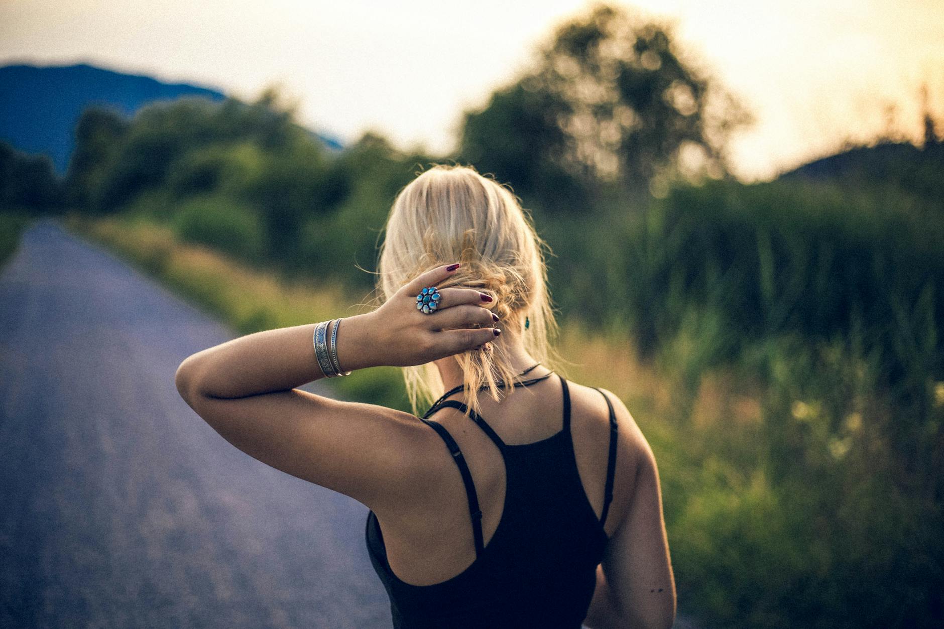 woman holder her hair outdoors